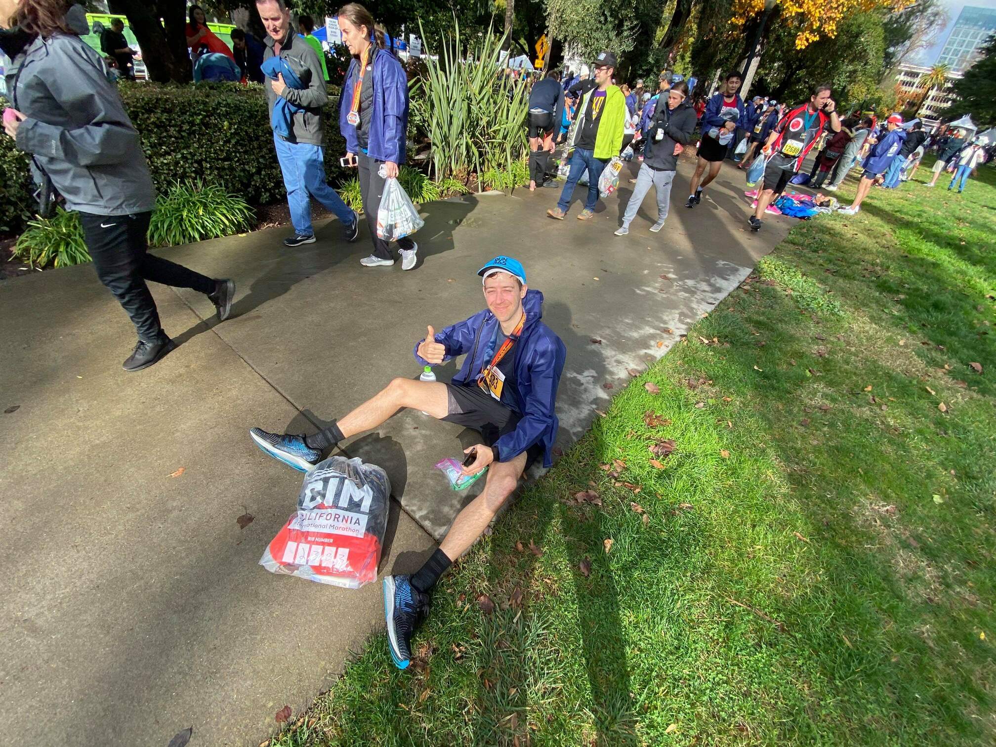 Jeff sitting on the sidewalk after the race.